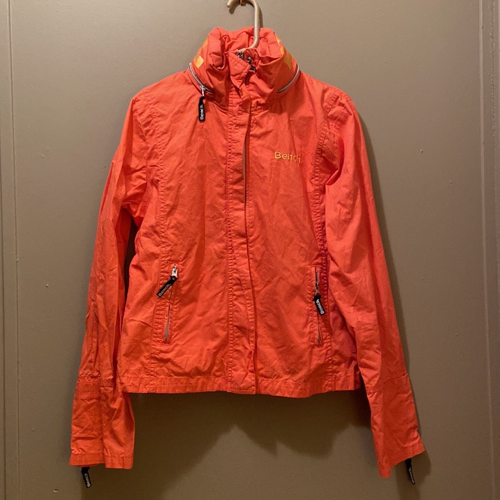 Women’s Bench orange jacket, zip up, hidden hood, urban wear, size large.
